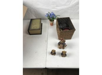Box With Various Decorations Including Candle And A Book Chest
