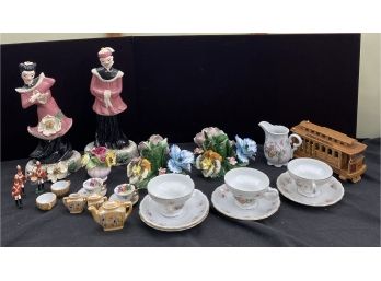 An Assortment Of Ceramic And Porcelain Decor Items