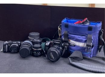 Several Canon Cameras And Lenses