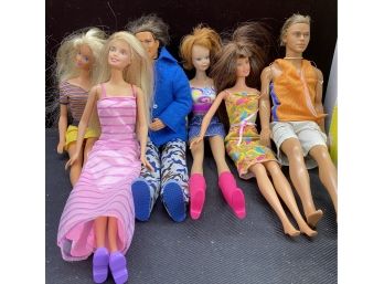 Assorted Barbies, Clothes, And Cases