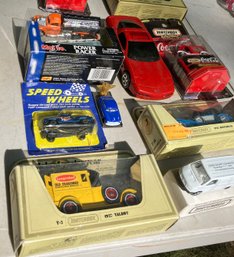 Lot Of 12 Mint In Package Toy Cars And Trucks Mfg By Matchbox, GM And Others