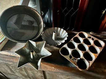 Lot Of 4 Primitive Cookware Items Incl 2 Jello Molds, Strainer And A Cast Iron Muffin Pan