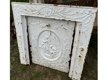 Victorian Cast Iron Fireplace Surround And Door With Bas Relief Figural Front Of Man Playing Flute And Maiden