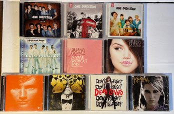 Lot Of 10 CDs: One Direction, Ed Sheerin, Selena Gomez, Justin Timberlake, Keisha, Backstreet Boys, Etc.