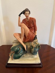 Porcelain Figure Sitting On Steps