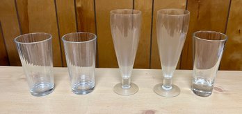 2- Pasabahce Glassware, 2 Plastic Pilsner Cups And One Random Glassware
