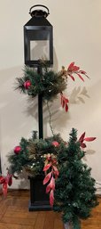 Tall Christmas Light Post Decoration And Small Undecorated Tree