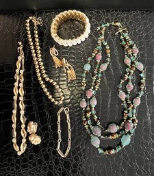 Costume Jewelry Lot: 3 Necklaces, 2 Bracelets And 2 Clip On Earrings: Trifari, Monet, And More