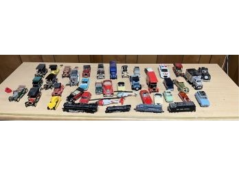 41 Mix Cars, Lionel Trains, And Helicopters
