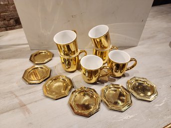 6 Gold Coffee Cups And 6 Brass Coasters