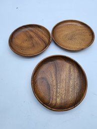 3 MCM WOOD PLATES AND 1 SMALL BUD VASE HAND CARVED.  WILL SHIP