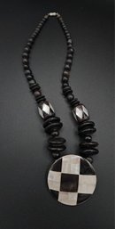 Graduated Wood Beaded Necklace With Mother Pearl Center Pendant