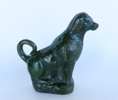 A Redware Seated Spaniel Dog Bank, Decorated With A Green Glaze With Manganese Splotches, Probably Pennsylvani