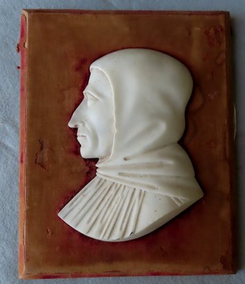 A Carved Silhouette Marble Sculpture Of A Monk Mounted On A Wooden Board