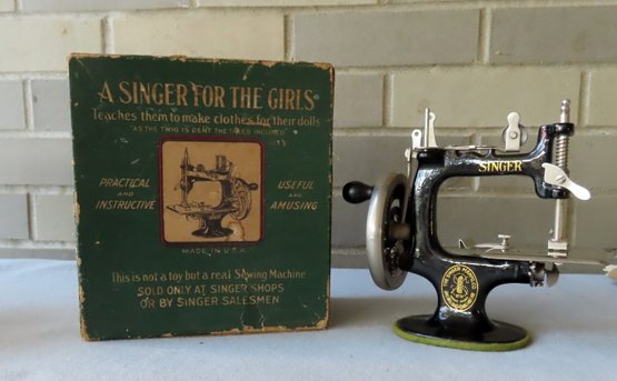A Childs Singer Sewing Machine In Original Box,