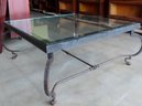 A Large Wrought Iron Coffee Table With Thick Glass Top, Circa 1930. The Glass Top With Some Surface Scratches
