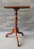 A Maple Candlestand With Rectangular Top, Turned Post Leading To Spider Scrolled Legs, Early 19th Century. The