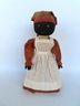 A Folkart Black Mammy Whisk Broom Doll With Hand Painted Stocking Face And Original Hand Made Costume, Late 19