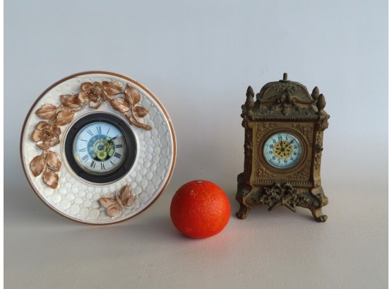 Two Clocks Including: A Windup Majolica Wall Clock Decorated With Embossed Flowers