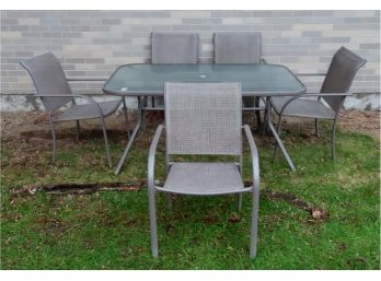 A Modern All Weather Patio Set Consisting Of Rectangular Glass Top Patio Table And 5 Chairs