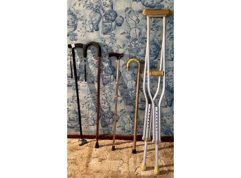 Assorted Canes And A Pair Of Crutches