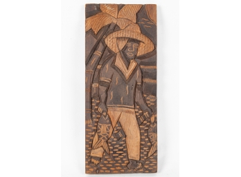 Carved Wooden Panel Of A Fisherman