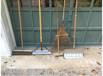 Three Push Brooms, Leaf Rake And A Snow Pusher Shovel