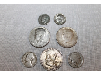 A 1954 Franklin Half Dollar, 1964 & 1980 Kennedy Half Dollar, 1966 & 1976 Dimes, 1942 Jefferson & Indian Head