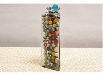 Glass Canister Full Of Marbles - Some Larger Ones