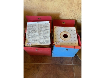 Two Containers Of 45s (Records)