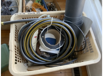 Lot Of Random Hoses And Other Items In Laundry Basket