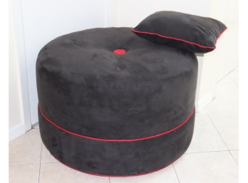 Round Charcoal Grey Ottoman With Red Trim Matching Pillow.