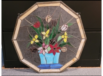A Ornate Stained Glass Wall Piece With Floral Pattern