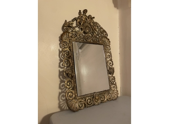 VICTORIAN MIRROR DEPICTING A CHERB, MYTHICAL FACES ON EACH SIDE