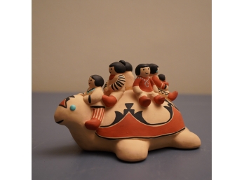 CERAMIC TURTLE WITH PEOPLE ON TOP