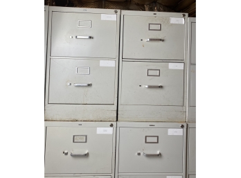 Four White Metal File Cabinets