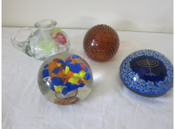 Four Paperweights