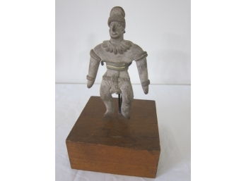 Small Stone Statue On Wooden Stand
