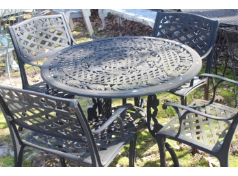 CAST IRON TABLE W/ 4 CHAIRS