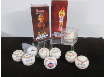 Group Of Signed Baseballs And Bobbleheads