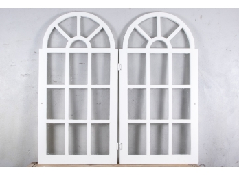 Two White Paint Decorated Arched Windows With Wavy Glass