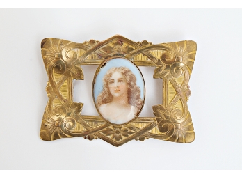 Gold Colored Metal Framed Pin Set With An Oval Porcelain Medallion Of A Young Girl