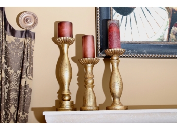 Three Graduated  Ceramic Gold Painted Candlesticks