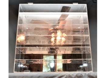 Four Display Cases With Reflective Background