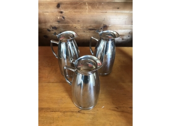 Three Stainless Pitchers