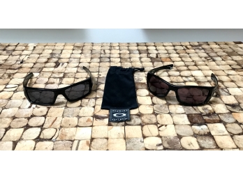 Two Pairs Of Oakley Sunglasses