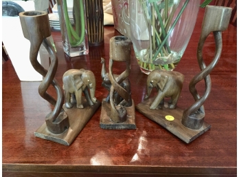 Three Carved Wooden Elephants With Spiral Candle Holders