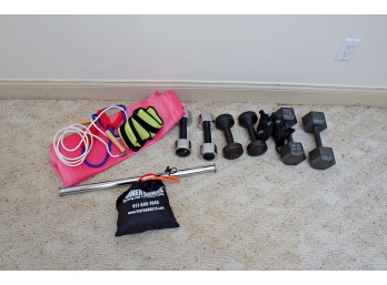 Group Of Hand Weights And Floor Exercise Equipment