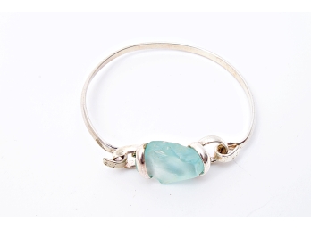Polished Silver Tone Bracelet With Free Form Light Green/Blue Glass
