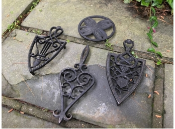 Group Of Four Iron Trivets
